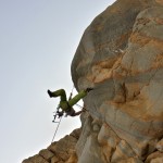 Benny attempting to drill in an overhang. | Photo: A. Burger